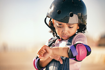 Image showing Cycling injury, child and pain from a bike accident outdoor feeling stress and sadness. Young girl and summer cyclist or skating activity with a helmet and safety gear with arm bruise problem