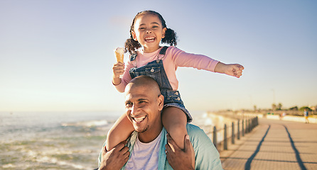 Image showing Family, children and piggyback with a father and daughter eating ice cream while walking on the promenade together. Sky, nature and kids with a man and girl bonding with the sea or ocean at the beach