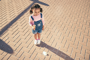 Image showing Crying kid drop ice cream on floor, ground and street in summer, sunshine and outdoors. Sad, unhappy and frustrated girl child in tears for icecream accident, messy dessert mistake and candy problem