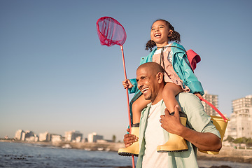 Image showing Family, children and piggyback with a father and daughter fishing while walking on the beach promenade. Nature, sky travel with a man and girl bonding together during summer vacation or holiday