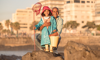 Image showing Father, daughter and fishing portrait with a man and child on a ocean holiday for bonding with love. Fish, net and bucket with a dad and girl kid relaxing together to catch fish on a seaside vacation