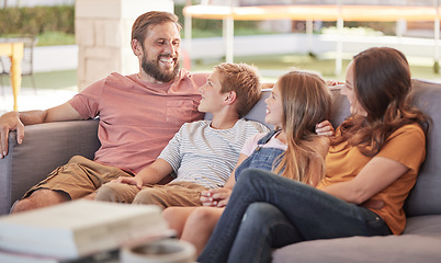 Image showing Happy family, sofa and relax together, laugh and funny joke with smile, happiness and sitting in home. Father, mother and young kids on couch with bonding, comic and love in lounge at holiday house