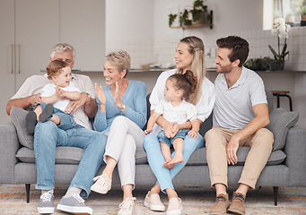 Image showing Big family, love and relax on sofa in home living room, bonding and enjoying quality time together. Support, care and grandma and grandpa playing with baby and having fun with mother, father and girl