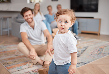 Image showing Baby, portrait and play in living room with family, curious and energy, cute and little with dad, mom and grandparents. Boy , mother and father bonding in lounge with grandmother and grandfather