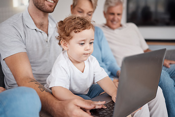 Image showing Family, laptop and baby in living room learning how to type or playing game. Big family, education and development of child, infant or kid on computer with father, grandmother and grandfather in home