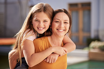 Image showing Girl, mom and piggy back with smile in portrait in home garden, backyard or sunshine together for fun. Mother, child and carrying on back for hug, love or bonding outdoor with smile, happy and summer