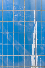 Image showing Blue ceramic tile wall with paint splash