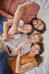 Image showing Happy family, love and relax in bed with children and parents laughing, bond and resting in their home together. Parents, kids and laughter in a bedroom, enjoying a lazy day at home with top view