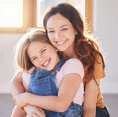 Image showing Mother, love and hug girl for portrait of support, trust and relax quality time in family home. Happy mom, excited kid and smile together for happiness, gratitude connection and relationship bonding