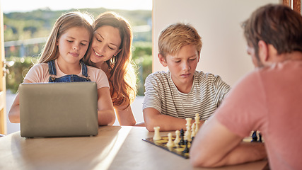 Image showing Family, parents and kids with laptop, chess and learning together in home for fun, education and bonding. Dad, children and board games for mind, strategy and development with pc, mother and daughter