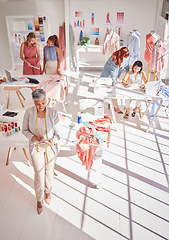 Image showing Teamwork, fashion and designer with business women in studio workshop for creative, fabric and luxury. Retail, planning and management with employee in factory for textile, idea and manufacturing