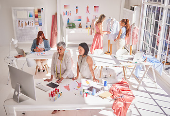 Image showing Clothes production, designer and women working on fashion, fabric and textile planning work. Creative studio busy with idea, style innovation and creativity design with collaboration and teamwork