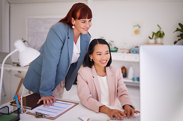 Image showing Business women, coach or manager at computer for ideas, training and advice for online marketing project at office desk. Happy female entrepreneur and mentor busy with data analytics together