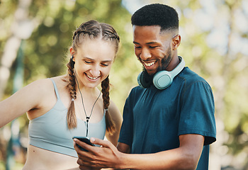 Image showing Fitness, social media and couple with phone in a park for training, mobile app and funny video. Communication, comedy and black man and woman reading about a cardio workout on a mobile in nature