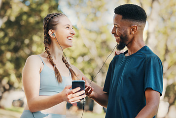 Image showing Music, fitness and running with a diversity couple outdoor in park for exercise or training together. Fitness, phone and workout with a sports man and woman outside listening to runner motivation