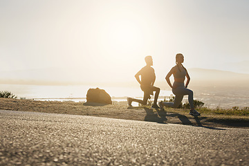 Image showing Man, woman or fitness stretching at sunset for exercise, training or workout for heart health, cardio or muscle growth. Runners, sports team or athletes in wellness warm up on remote mountain sunrise