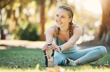 Image showing Fitness, woman and stretching by woman in a park for yoga, wellness and exercise, zen and happy in nature. Exercise, girl and leg stretch before mediation in a forest for cardio, workout and pilates