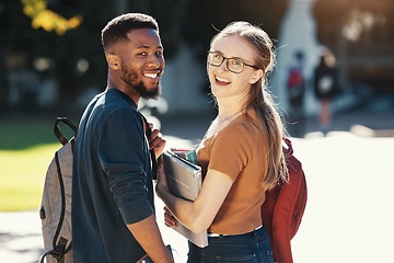 Image showing Education, university and students with couple who are interracial on campus for academic and learning. Black man, woman and smile in portrait with books to study, outdoor and college life.