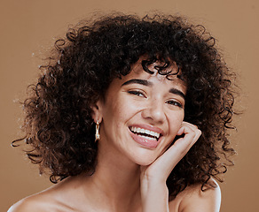Image showing Face portrait, makeup and beauty of woman in studio isolated on a brown background. Cosmetics, aesthetics and young female model from Brazil happy and satisfied with skincare routine for healthy skin