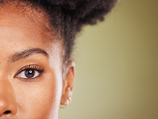 Image showing Beauty, black woman and half face portrait for dermatology, facial or skincare advertising. Wellness, health and natural skin cosmetic zoom of model with green studio mockup for marketing.