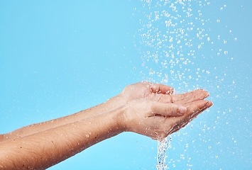 Image showing Water splash, hands and cleaning of a person busy with hand hygiene, skincare or hydration. Natural, clean flow and water for washing and cleaning skin and body under water or holding for a drink