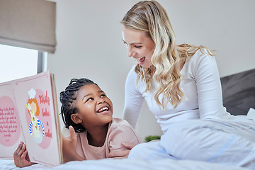 Image showing Mother, child and bonding with books to read, learn and development with language and fiction. Woman, girl and book for reading and learning, education and storytelling in bed and happy together.