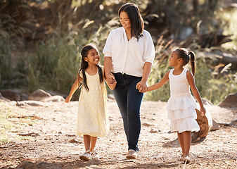 Image showing Mother, children and park walking holding hands with girl and mama in summer with happiness. Kids love, smile and kids care relax in nature with mom support and sunshine together feeling happy