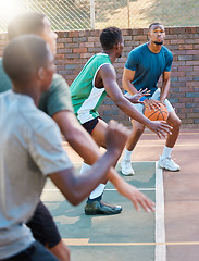 Image showing Basketball, game and team sports for match point, score or ready for a shot at the basketball court. Basketball players in sport fitness, exercise or workout at the court together in the outdoors