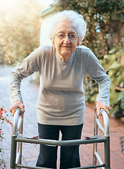 Image showing Portrait, old woman and walking frame at park for healthcare, wellness and healthy sunshine. Freedom, retirement and elderly female with disability outdoors in nature or garden for fresh air alone.