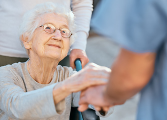 Image showing Holding hands, caregiver and senior woman in wheelchair for support outdoor in retirement home. Love, trust and healthcare nurse or medical wellness doctor for disability patient with kindness