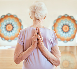 Image showing Elderly woman in pose for yoga, flexibility and fitness in studio, hands with arms stretching and vitality in old age. Balance, exercise and chakra with peace and body training and wellness.