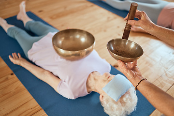 Image showing Singing bowls, meditation and senior woman on floor for healing, vibration and sound therapy with healer. Sound healing, zen and elderly lady on a ground for tibetan bowl music, relax and wellness