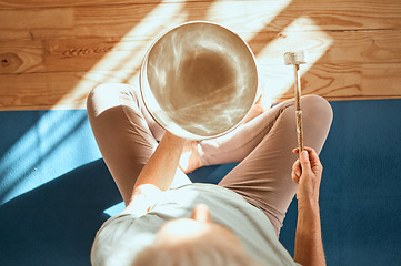 Image showing Yoga, wellness and meditation sound therapy of a senior woman doing zen, spiritual and calm workout. Above view of meditate, fitness and mindfulness exercise training on the living room ground