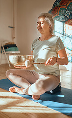 Image showing Meditation, elderly woman and mindfulness, zen and yoga in fitness studio with tibetan singing bowl, balance and peace. Wellness, spiritual and wellness ritual for calm and harmony with buddhism.