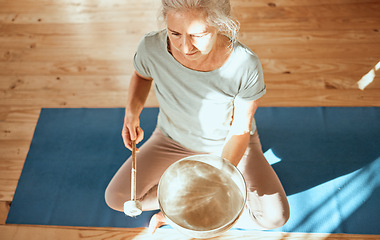 Image showing Sound healing, bowl and senior yoga woman practice alternative medicine for aura, soul or chakra energy balance. Audio holistic healthcare, music therapy and top view of yogi with singing bowl