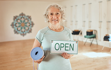 Image showing Yoga, elderly woman with open sign in fitness portrait and pilates studio with exercise for senior people. Wellness, training and health motivation, active lifestyle and vitality in retirement.