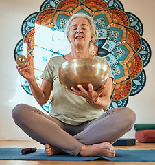 Image showing Senior woman, yoga and meditation in fitness studio for body health and wellness motivation with gold bowl and mandala. Spiritual, energy and balance with mindfulness and zen, healthy and peace.