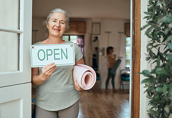 Image showing Woman, portrait and advertising open sign, yoga studio and fitness club, healthy lifestyle and senior wellness. Happy old woman at door of exercise, workout and training center with marketing signage
