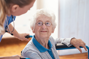 Image showing Disability, nursing and senior woman with a doctor for care, consultation and medical help at a hospital. Healthcare, communication and elderly patient in a wheelchair with a nurse in a home