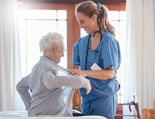 Image showing Nurse, healthcare and senior woman in nursing home with physician helping her dress up. Disability, rehabilitation and female medical worker with retired patient in home with care, empathy or support