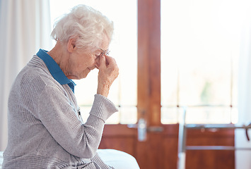 Image showing Senior woman, headache and stress with anxiety in retirement house, lonely and sad with mental health. Elderly female, depression and frustrated with fear for health, fail and mad with grief problem