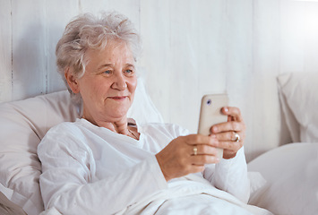 Image showing Bed, phone and relax senior patient search internet, web or online for subscription movie, show or entertainment. Healthcare, elderly care and old woman streaming video in retirement nursing home