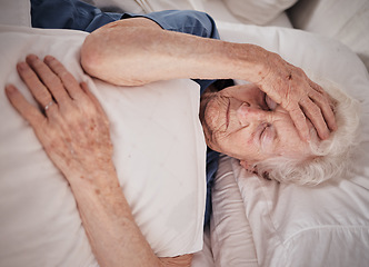 Image showing Headache, pain and senior woman in bed for trauma recovery, rehabilitation or rest in elderly care nursing home. Healthcare problem, medical emergency crisis and retirement patient with brain cancer