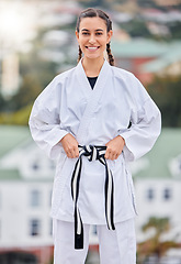 Image showing Woman, karate and smile in outdoor portrait with happiness for training, fitness and wellness in sunshine. Girl, martial arts and self defence with happy, sport and motivation in metro, town or city