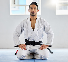 Image showing Portrait, karate and sensei with a sports man kneeling on the gym floor of a dojo or fitness club for self defense. Training, workout and fight with a martial arts professional in a sport facility