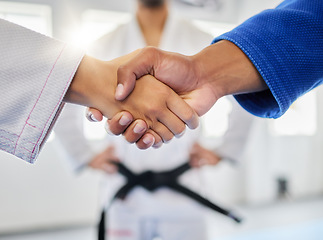 Image showing Handshake, karate and sports with a man and woman fighter shaking hands in a gym, club or dojo. Fitness, exercise and thank you with a male and female athlete showing sportsmanship before a fight