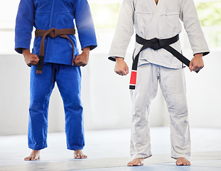 Image showing Karate, uniform and men in dojo, uniform and start training, exercise and workout with commitment and motivation. Fighter, uniform and coach with coaching, fitness and sports practice in gym or club