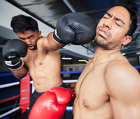 Image showing Fitness, exercise and boxing match, punch or knock out in ring. Healthcare, sports or boxers, athletes or fighters fighting in competition, training or workout for wellness in gym or fitness center.