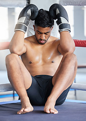 Image showing Tired man, boxer and fitness in sports match for ring out finish, training or competitive workout at the gym. Exhausted or fatigue man fighter in boxing arena on break from intense fighting exercise