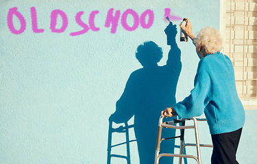 Image showing Senior woman, graffiti and wall with spray paint for street art in city, town or metro in retirement. Elderly rebel, painting or pop art in urban outdoor with vandalism, spray or painting in sunshine